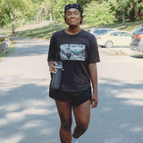 Reality Run Perspective Tee in Charcoal, front, worn at a Lap One RUNCLUB run